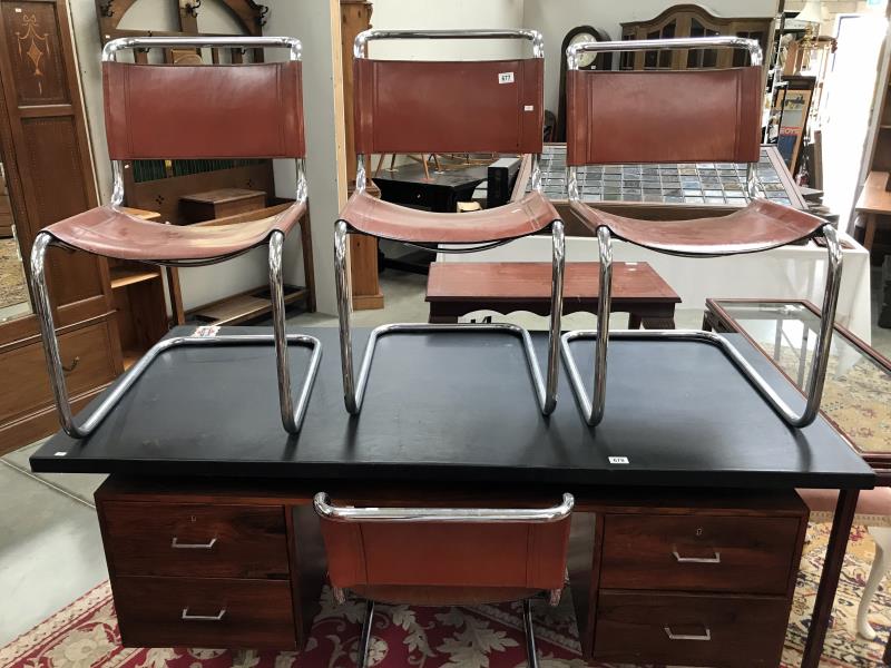 A set of 4 Marcel Breuer brown leather and chrome chairs.