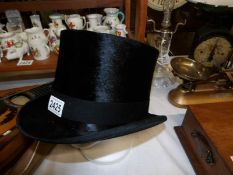 A black top hat by Lincoln Bennett.