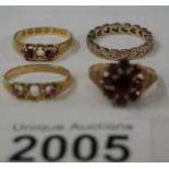 A 9ct gold ring set garnets, an 18ct gold ring with central stone missing,