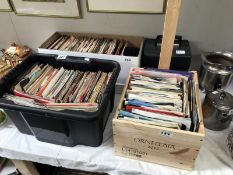 A quantity of 45rpm records in 4 boxes