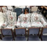A floral 2 seater sofa and a matching armchair