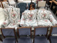 A floral 2 seater sofa and a matching armchair