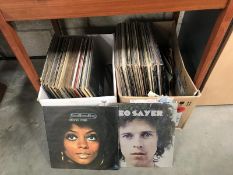 A quantity of 1970's/80's LP and 45rpm records including Queen, David Bowie, Elton John etc.