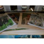 A portfolio of assorted pictures including watercolours, oil on board, artist signed prints,