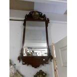 A mahogany framed mirror.