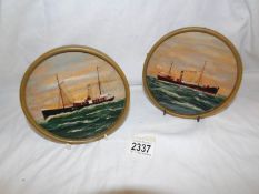 A pair of small circular paintings of sea going vessels initialed EKR.