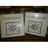 A pair of illuminating signs 'The Eclipse'.