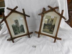 2 19th century oak picture frames containing studies of churches.