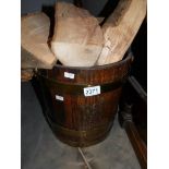 An oak log bin with logs.