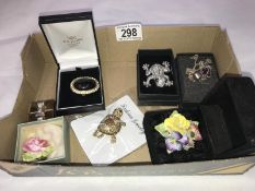 A collection of costume jewellery including rings and brooches