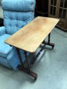 A Victorian mahogany side table with bobbin turned legs and cross stretcher