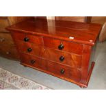 A mahogany 2 over 2 chest of drawers.