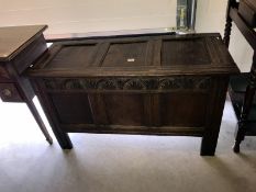 A 19th century oak coffer with carved & panelled front