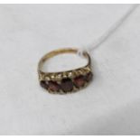 An 18ct gold ring set 5 rubies and 8 small diamonds, size N.