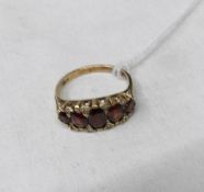 An 18ct gold ring set 5 rubies and 8 small diamonds, size N.