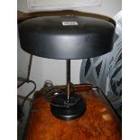 A 1950's Phillip's black and chrome table lamp.