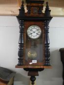 A mahogany wall clock.