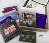 A mixed lot of commemorative coin sets.