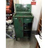 A vintage industrial storage cabinet