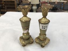 A pair of onyx and gilt candlesticks
