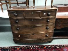 A Victorian mahogany thin top bow front chest of drawers with string inlay on drawer fronts