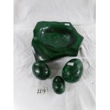 A heavy malachite bowl and 3 eggs.