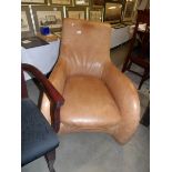 A 'Moreno' brown leather chair.