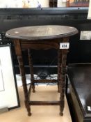 A 1930's oak side table with turned legs