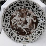 A large continental pottery classical scene charger.