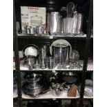 3 shelves of stainless steel kitchenware