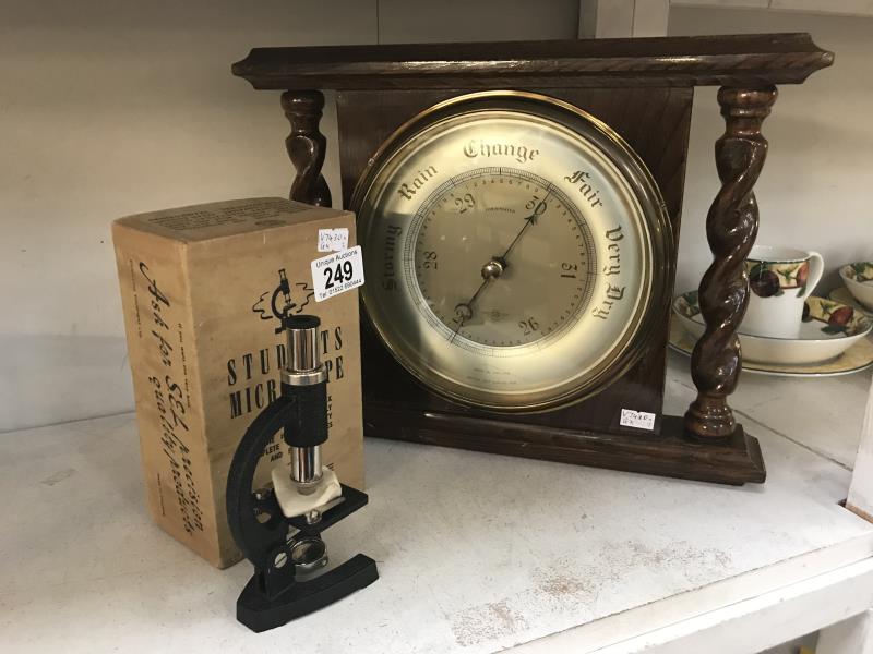 An SB aneroid barometer and boxed student microscope by Signalling Equipment LTD