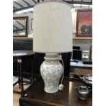A table lamp with oriental leaf design