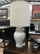 A table lamp with oriental leaf design