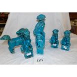 A pair of blue ceramic Chinese dogs of Foo and 4 others.