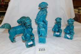 A pair of blue ceramic Chinese dogs of Foo and 4 others.
