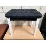 A deep button dressing table stool