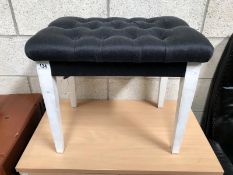 A deep button dressing table stool