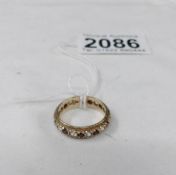 A 9ct gold and diamond full eternity ring, size L.