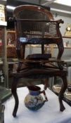 A 19th century child's high chair with cane seat and back (screws missing from tray).