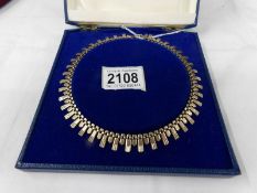 A 9ct gold cased necklace, approximately 16 grams.