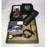 A box of wristwatches including model car and clocks