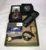 A box of wristwatches including model car and clocks