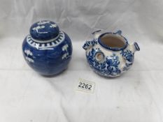 A blue and white oriental ginger jar and a Delft style blue and white pot.