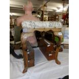 An early 19th century mahogany piano stool.