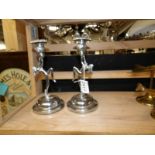 A pair of chrome art deco nude figurine candlesticks.