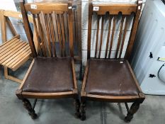 A pair of 1930's oak dining chairs