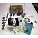 A collection of British coins and banknotes including commemorative