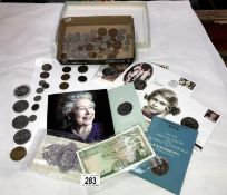 A collection of British coins and banknotes including commemorative