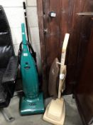 A vintage hoover vacuum cleaner and 1 other