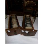 Two wooden drawers containing approximately 200 black and white glass lantern slides,